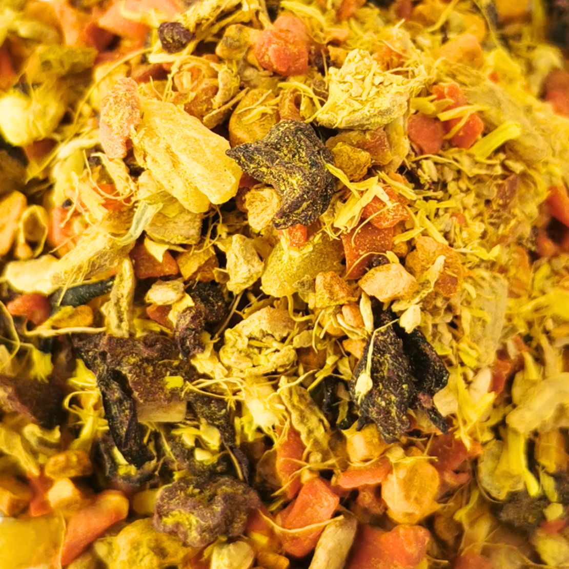 Heap of dried flowers and herbs on a white background