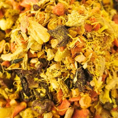 Heap of dried flowers and herbs on a white background