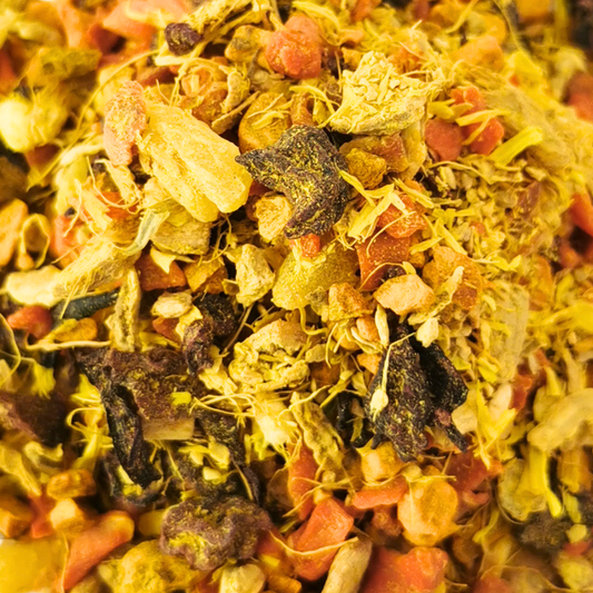 Heap of dried flowers and herbs on a white background